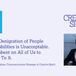 An OpEd graphic with a light blue background features bold blue and purple text. On the left, a turquoise box displays 'OpEd' in white letters. The main headline, in dark purple serif font, reads: 'Trump’s Denigration of People With Disabilities is Unacceptable. It’s Incumbent on All of Us to Stand Up To It.' Below, the byline in smaller purple text states, 'By Menachem Rephun, Communications Manager at Creative Spirit.' On the right, the 'Creative Spirit' logo is displayed, with the 'A' stylized as a human figure. Below the logo, a photo of Menachem Rephun, a bearded man in glasses wearing a black suit, white shirt, and pink tie, shows him smiling slightly against a waterfront background with a bridge in the distance.