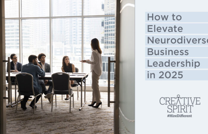 On the left of this graphic is an image of employees conducting a meeting in an office space. Four people are seated at a table and directing their attention to a woman standing at the head of the table speaking. On the right of the graphic is a light blue background with text that reads "How to Elevate Neurodiverse Business Leadership in 2025". At the bottom of the text is the Creative Spirit logo and #HireDifferent.