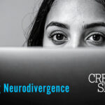 A black and white image of a woman who's face is partially covered by a computer screen. At the bottom of the image is blue text that reads "Masking Neurodivergence" along with the Creative Spirit logo.